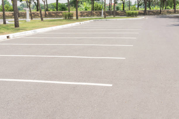 istock Empty Space in a Parking Lot / Empty space parking lot outdoor in public park. 896288374