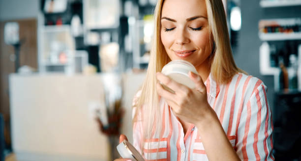 istock Beautiful young lady applying moisturizing creme 896292308