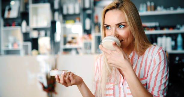 istock Middle-aged blond woman putting cosmetics 896292408