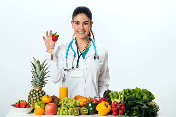 istock Female dietitian in uniform with stethoscope 896292426