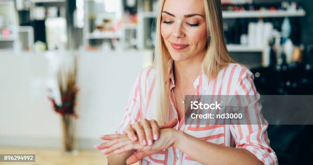 Woman Applying Moisturizing Cream On Hands Stock Photo - Download Image Now - Hand, Women, Moisturizer