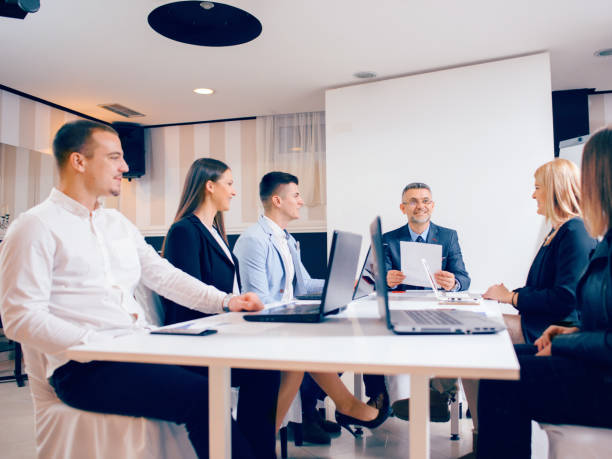 istock Businessman presenting to colleagues at a meeting 896302908