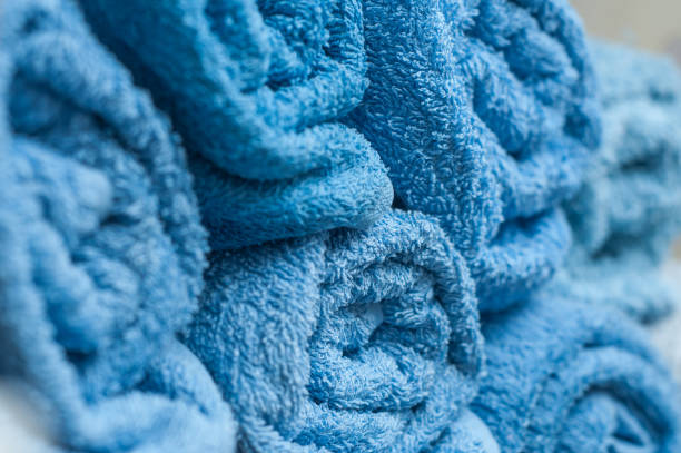 istock blue rolled bath towels in bathroom 896306436