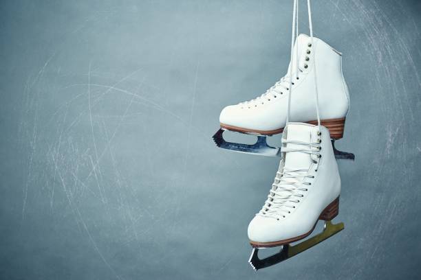 istock Women's skates with laces on a gray background. 896316562
