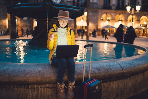 Girl in Barcelona booking hotel online