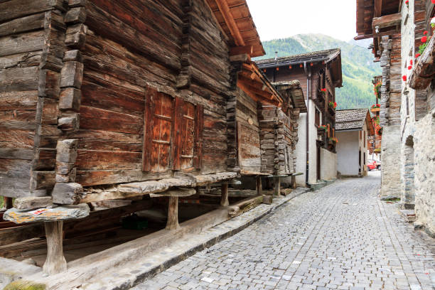 Beautiful traditional wooden houses in the streets of the alpine village Grimentz, Switzerland, in the canton Valais, municipality Anniviers