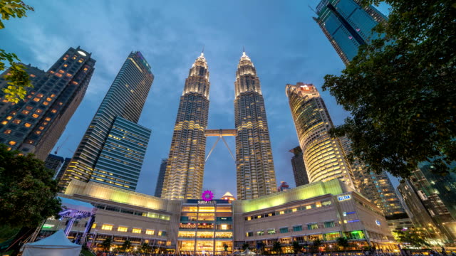 Timelapse Day-night passage near the Petronas Twin Towers in Kuala Lumpur, Malaysia. August 2017
