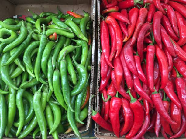 istock Green and red chili peppers stacked. 896319716