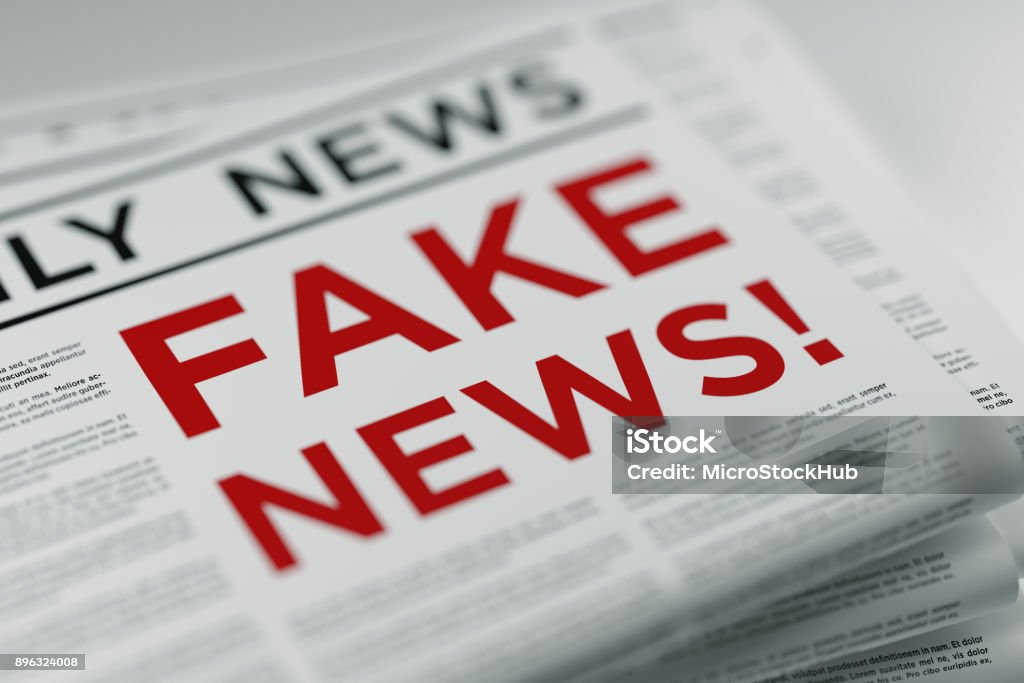 Fake News And Fake Newspaper Fake news and fake newspaper. Horizontal composition with selective focus and copy space. Fake News Stock Photo