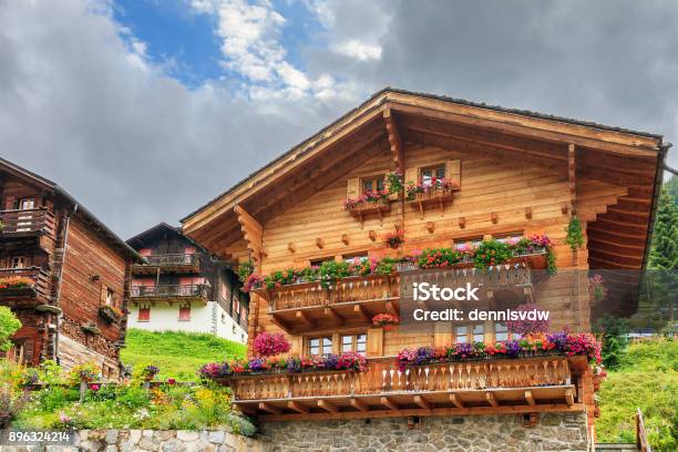 Chalet With Geraniums In Grimentz Stock Photo - Download Image Now - Switzerland, Chalet, Swiss Culture