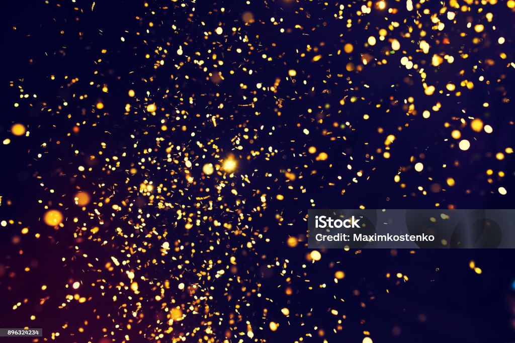 Foto von golden Glitter auf einem schwarzen Hintergrund. Goldene explosion - Lizenzfrei Konfetti Stock-Foto