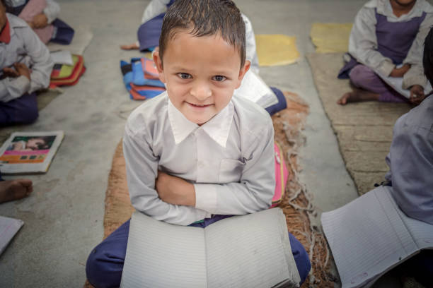 istock Happy smiling little rural school kids 896330380