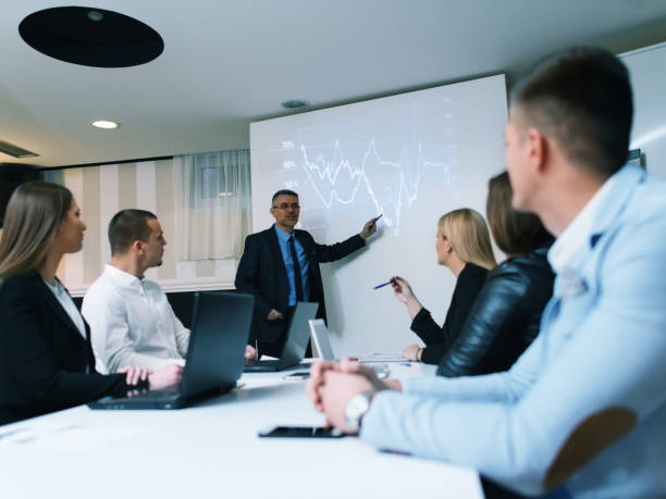 istock Businessman presenting to colleagues at a meeting 896330654