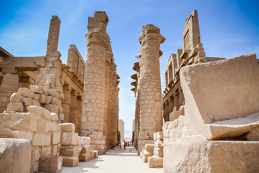 A tourist examines ancient hieroglyphics  at the Edfu temple in Egypt.