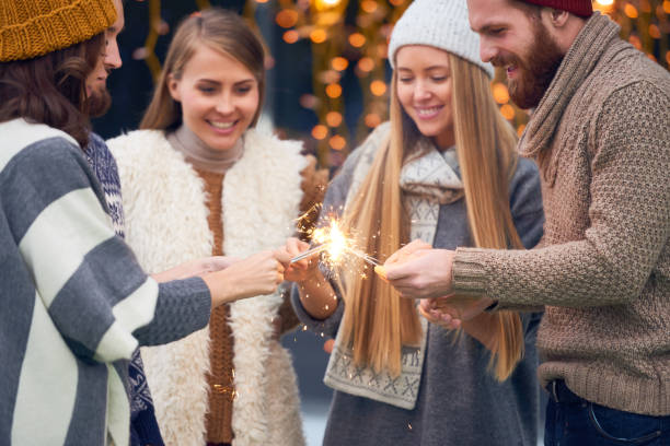 istock Cheerful friends making wishes at Christmas night 896340006