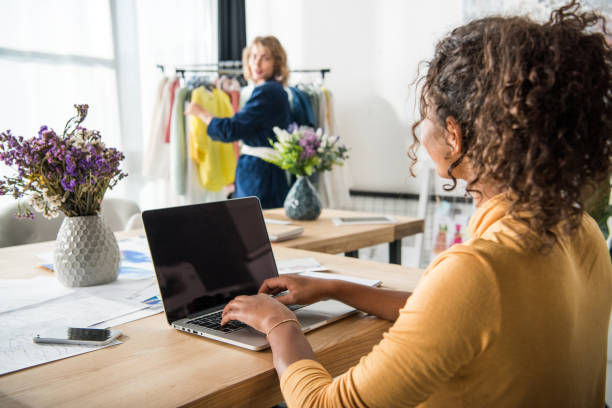 istock fashion designer with laptop 896340054