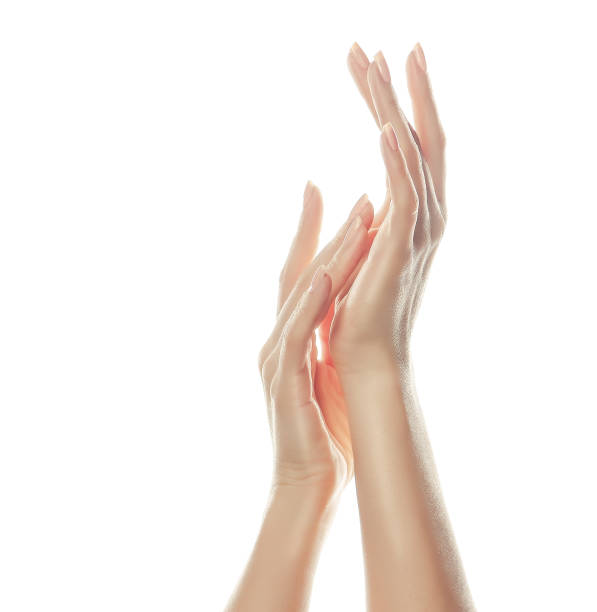 istock Elegant and graceful hands with slender graceful fingers is touching each other. 896340090