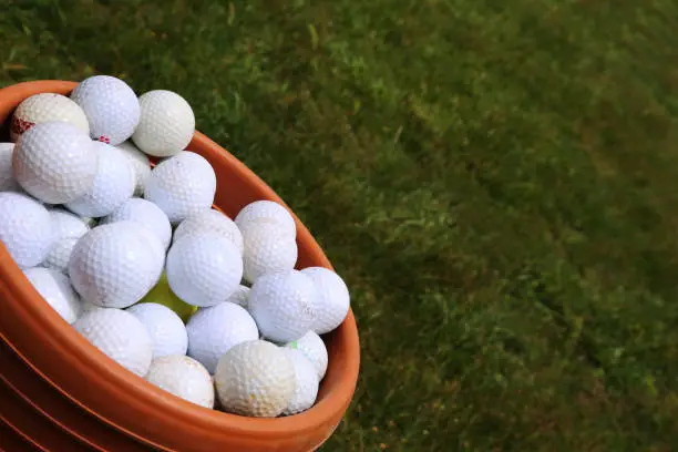Golf Balls. A full bucket of golfballs