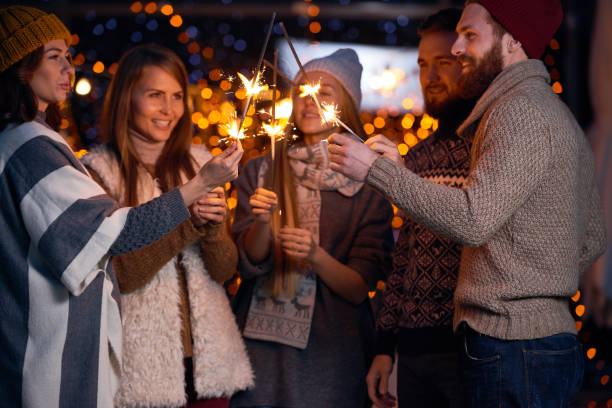 istock Joyful friends holding sparklers together 896345070
