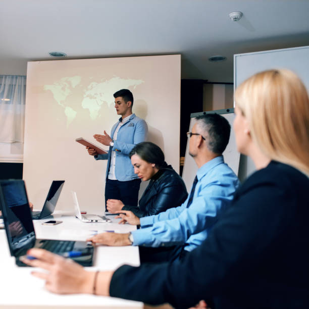 istock Businessman presenting to colleagues at a meeting 896345188