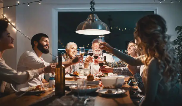 Photo of Family having dinner on Christmas eve.
