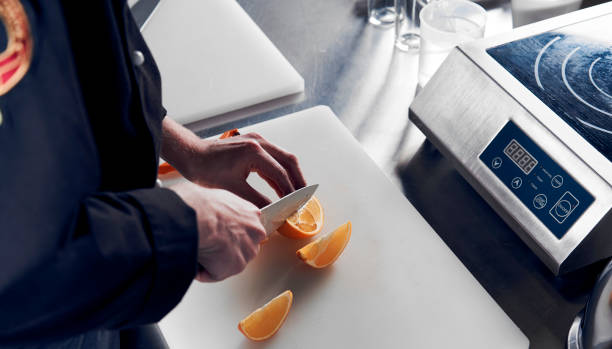 processo de cozimento o coquetel de vitamina de citrinos e gengibre - kitchen knife raw food food and drink fork - fotografias e filmes do acervo
