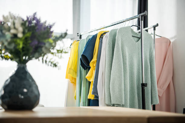 istock fashionable clothes on hangers 896349532