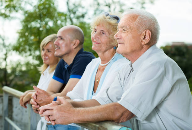 Postive french mature friends  in the green park