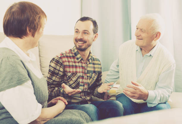 istock Grandparents and grandson talk 896355438