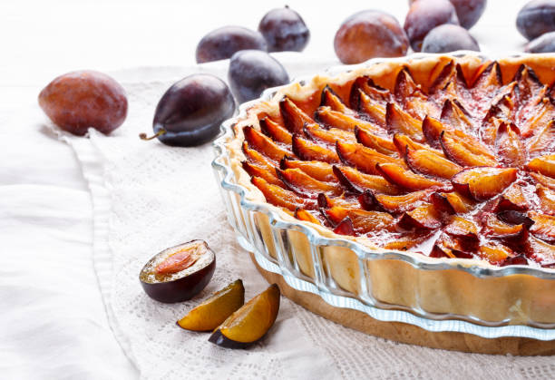 istock Homemade plum pie. Fruit tart on white table. Copy space. 896355450