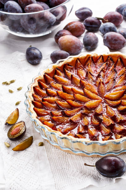 istock Homemade plum pie. Fruit tart on white table. 896355490