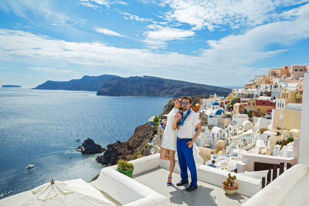 istock Beautiful young couple on sea background 896356082