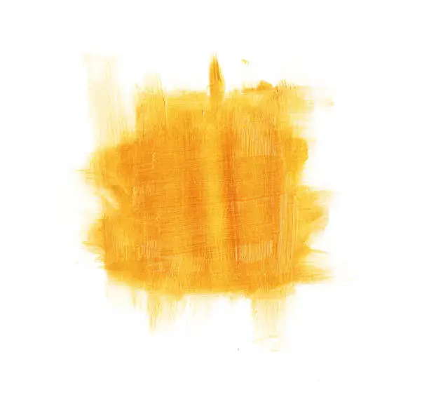 Photo of Abstract spontaneously painted square stain painted in gold with a roll on white sheet - background