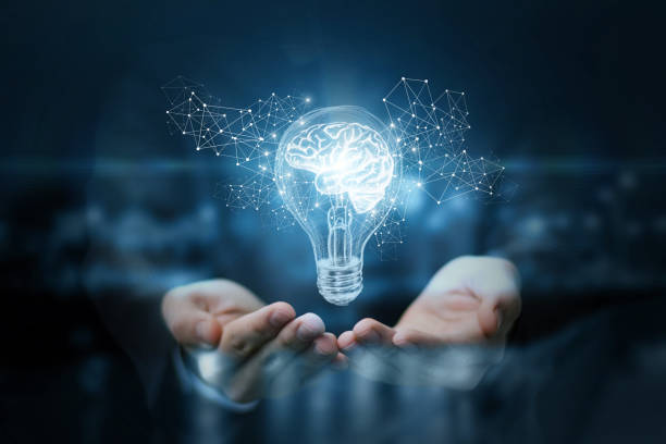 Light bulb with brain inside the hands of the businessman. Light bulb with brain inside the hands of the businessman. The concept of the business idea. turning on lamp stock pictures, royalty-free photos & images