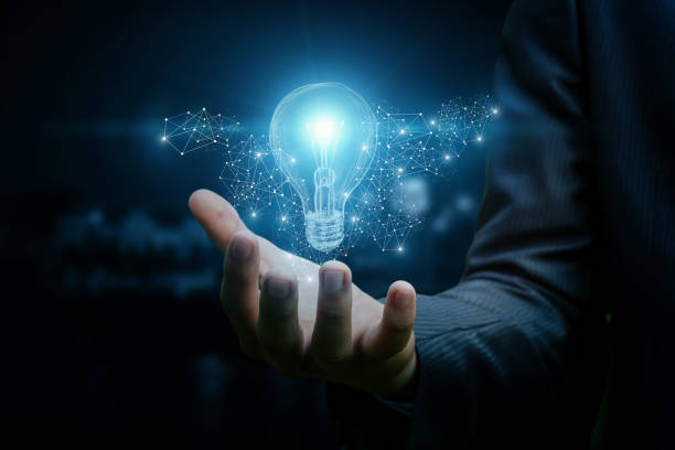 istock Drawing a light bulb in hand businessman. 896358722