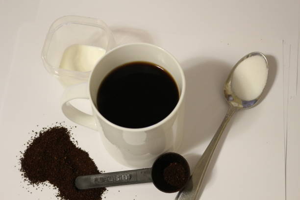 istock Coffee beans ground up, coffee, and sugar and cream 896359266