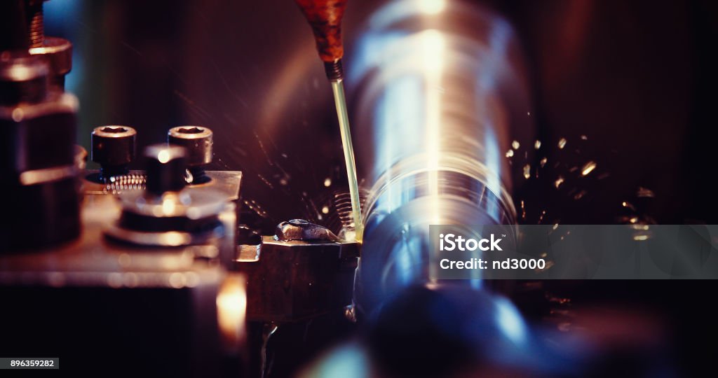 sparks flying while machine griding and finishing metal sparks flying while machine griding and finishing metal in factory Grinding Stock Photo