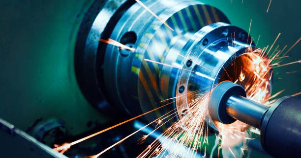 sparks flying while machine griding and finishing metal sparks flying while machine griding and finishing metal in factory worker with grinding machine power tool in factory stock pictures, royalty-free photos & images