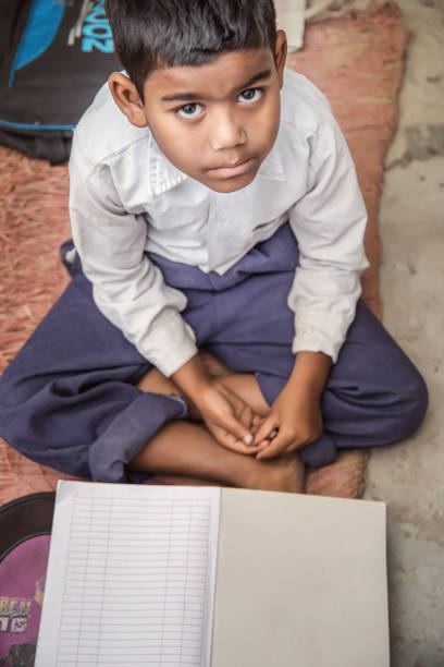 istock School Boy wearing uniform of Indian Ethnicity Smiling, looking at camera. 896371526