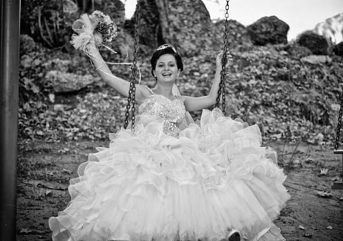 A beautiful bride on her wedding day in swing