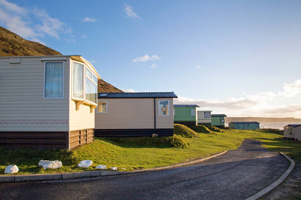 Hillend Caravan and Camping Park in Llangennith, Gower, UK Static caravan holiday homes at Llangennith on the Gower Peninsular in out of season winter. The caravans are closed up until spring. gower peninsular stock pictures, royalty-free photos & images