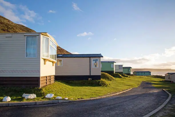 Static caravan holiday homes at Llangennith on the Gower Peninsular in out of season winter. The caravans are closed up until spring.