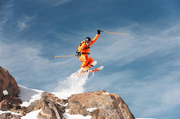 istock An athlete skier is jumping from high rock high in the mountains 896386540