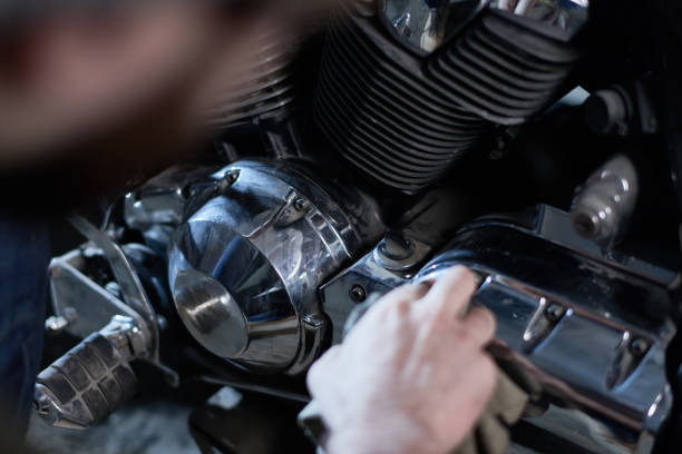 istock Biker taking care of motorcycle 896392220