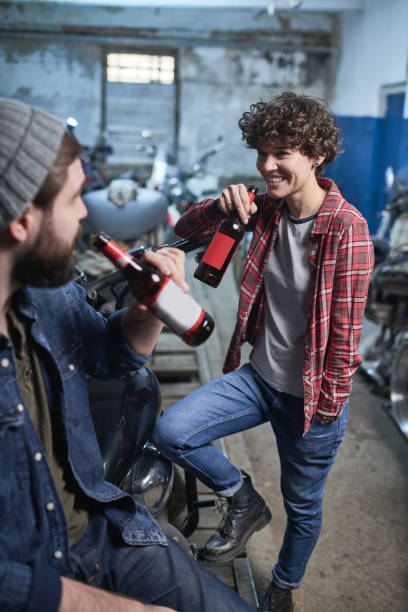 istock Jolly friends drinking beer in garage 896392694