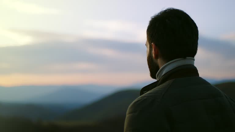 Man hiker looking in distance