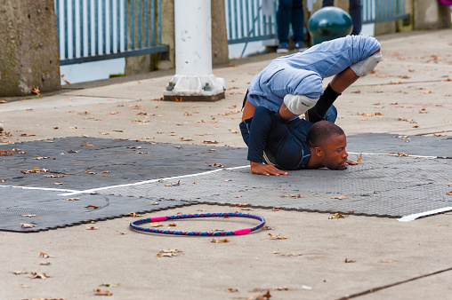 Portland, Oregon,USA - October 8, 2016: A street entertainer does Contortions along the City's waterfront in downtown Portland.