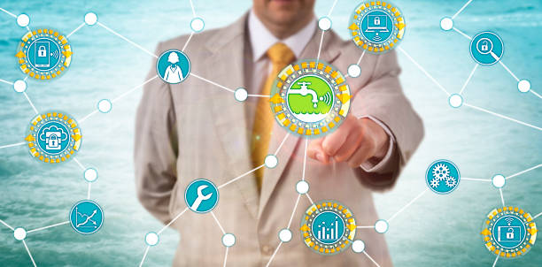 Unrecognizable Manager Monitors Water Efficiency Unrecognizable manager accessing data on water usage. Industry concept for efficient water management, wastewater engineering, system analysis, sustainability and protection of natural resources. public utility stock pictures, royalty-free photos & images