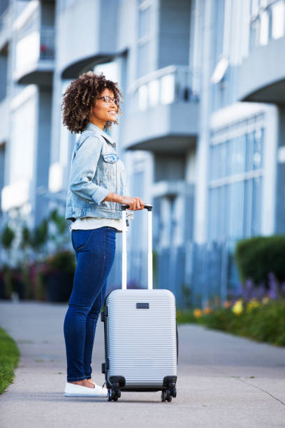 istock Woman with Carry on Luggage 896418778