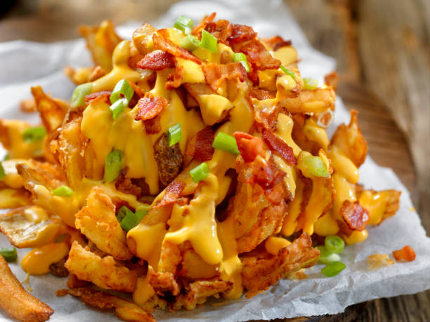 istock Loaded Blooming Onion with Fries, Cheese Sauce and Bacon 896421802